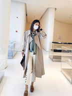 Green Bean Colored Windbreaker Coat for Women, Autumn 2023, Exuding a Stylish Middle-Length and Loose Fit with a Touch of Elegance, British-inspired Overcoat